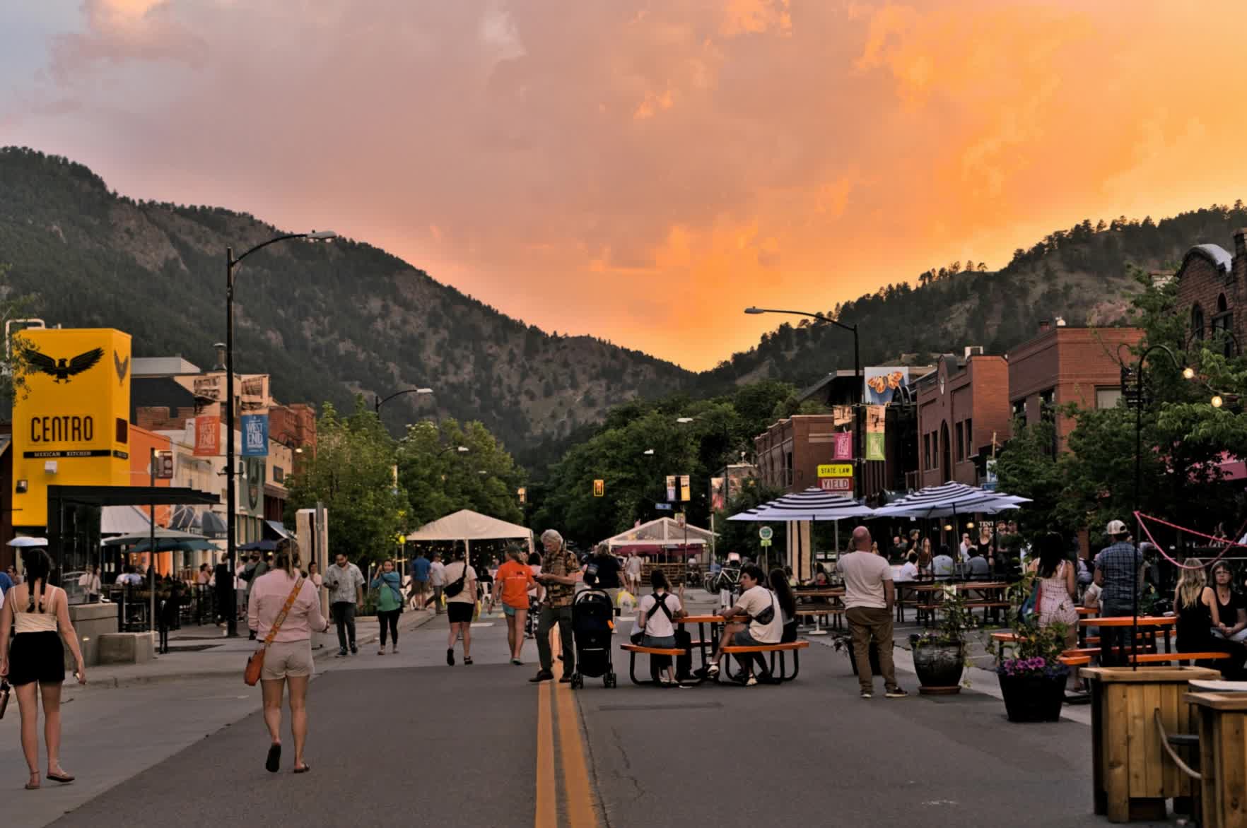 A sunset over Boulder’s downtown streets and foothills